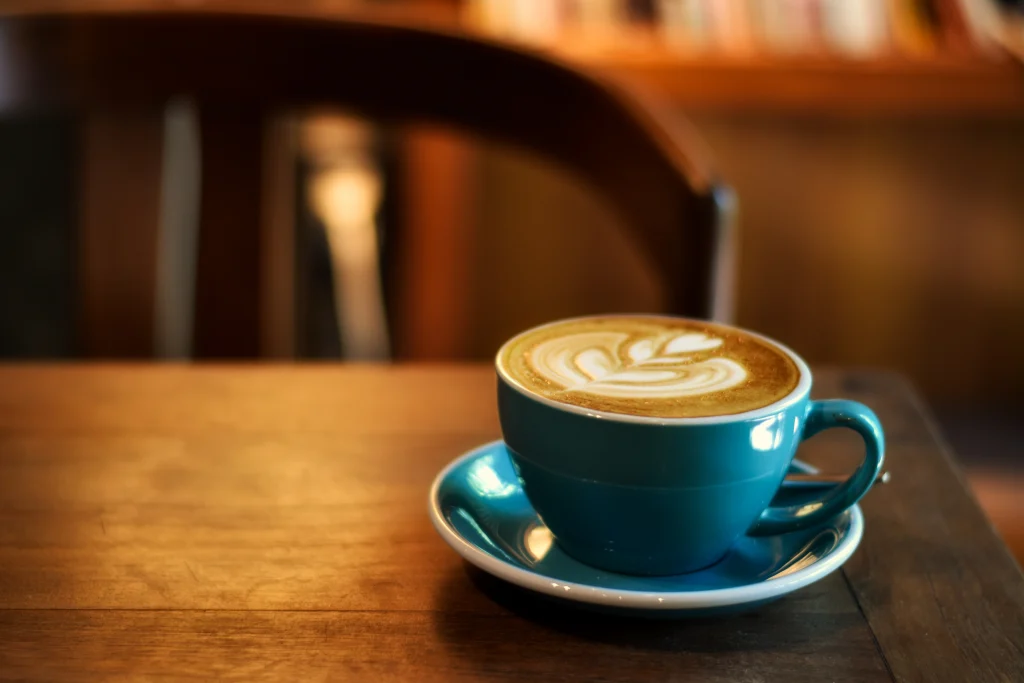 A cup of cappuccino in blue cup