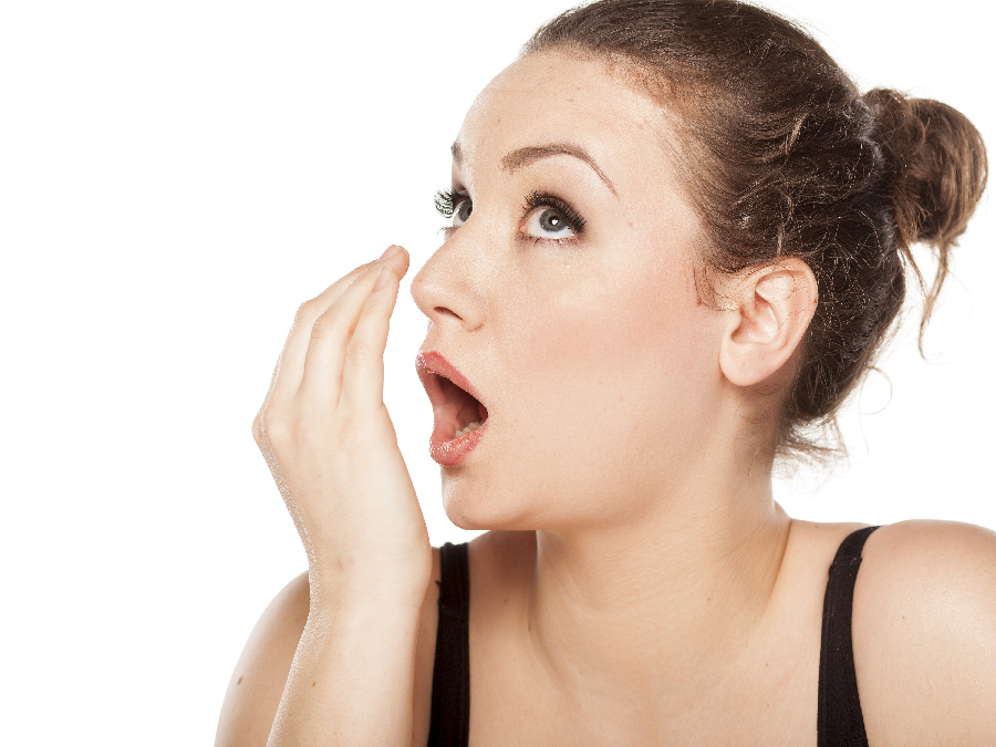 Woman checking if her breath smells