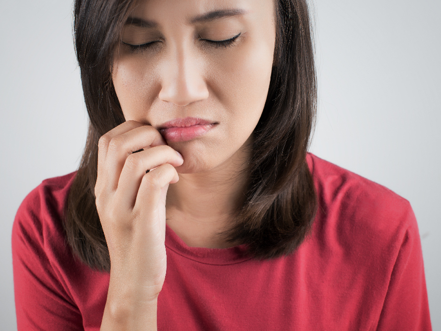 Woman in pain from accidentally biting cheek