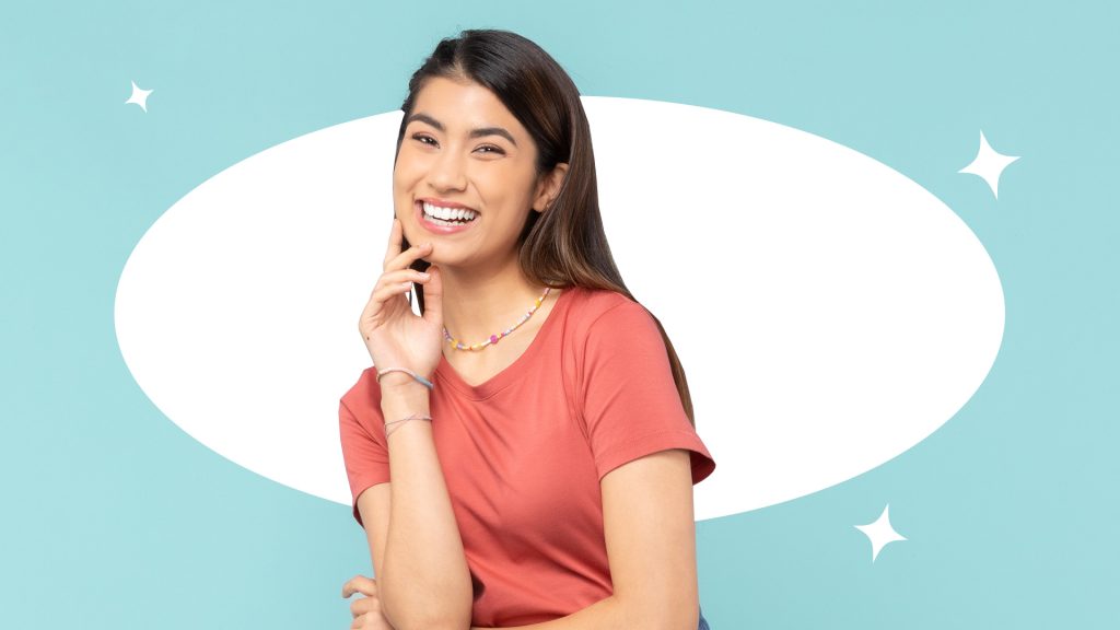 Woman posing with a confident smile and straight teeth