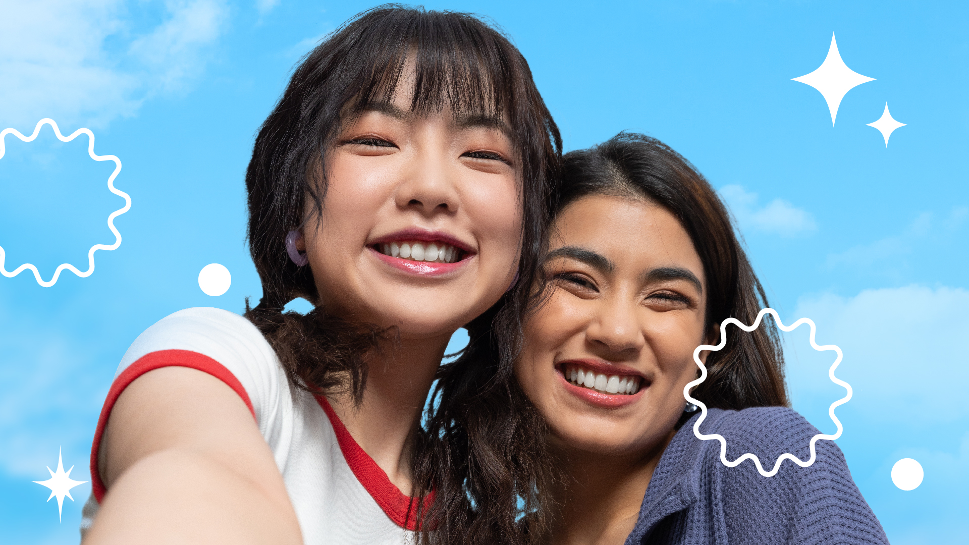 Two girls smiling with white teeth